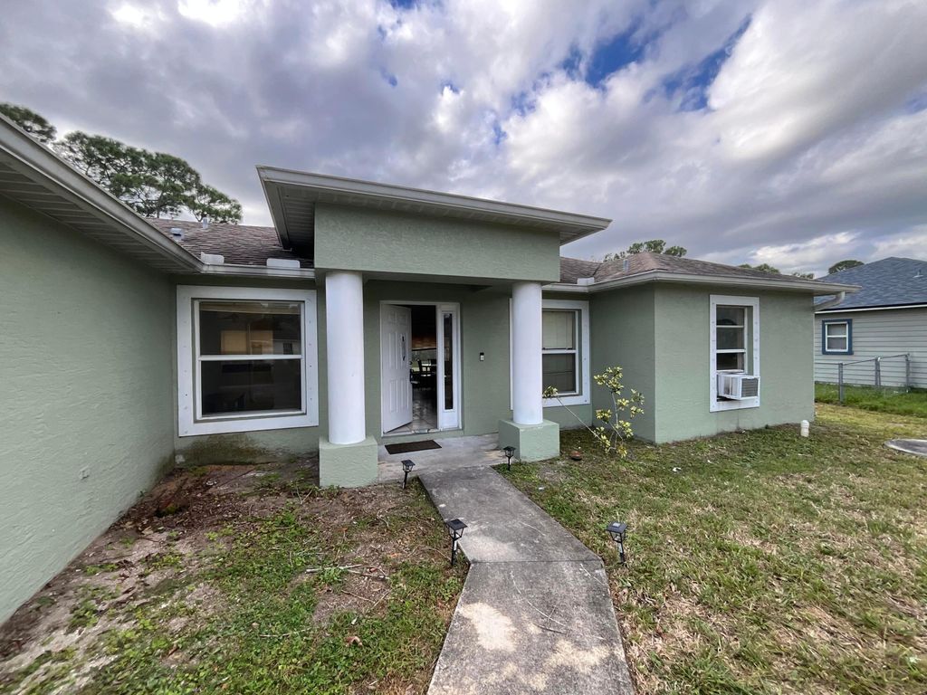 Photo of 1002 SW Romaine Lane, Port Saint Lucie, FL 34953 (MLS # R11145158)