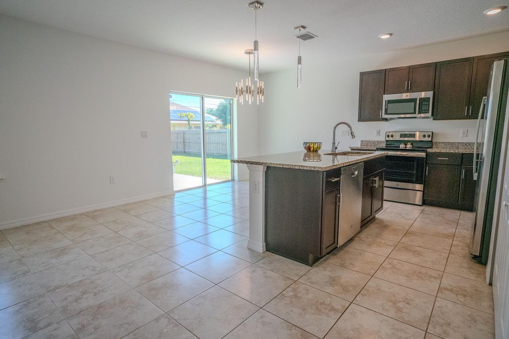 Photo of 1925 SW Cycle Street, Port Saint Lucie, FL 34953 (MLS # R10962216)