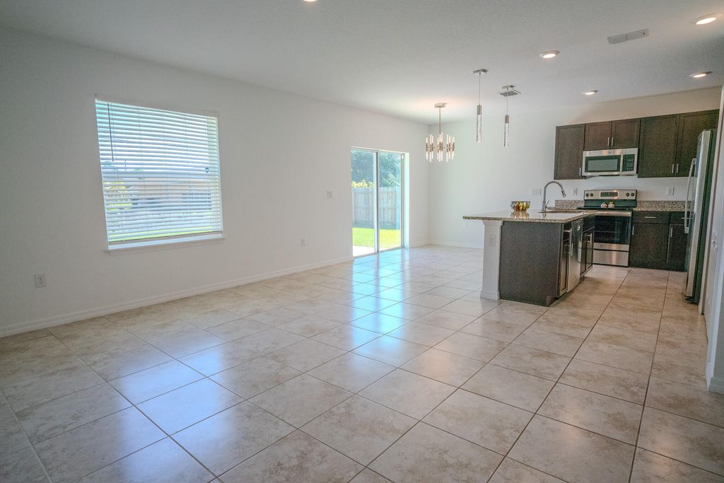 Photo of 1925 SW Cycle Street, Port Saint Lucie, FL 34953 (MLS # R10962216)