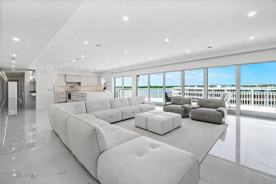 This Penthouse Residence Could Be Right Out Of Architectural Digest! This sensational 3BR/3BA Penthouse has been completely & beautifully re-imagined. The interior space is centered around a fabulous custom island kitchen with top of the line appliances including Thermador refrigeration & wine cooler & Fulgor Milano oven. Features include gorgeous porcelain floors throughout, custom cabinetry, custom overhead lighting in every room, a full size washer/dryer, media center and designer fixtures. The 3 en-suite bedroom suites are light bright & airy, all with custom closets & beautifully appointed bathrooms. The 3rd bedroom has been designed as a office/den. The incredible outdoor living space spans over 100' in length, taking in astounding panoramic Intracoastal views, & surrounding vistas.