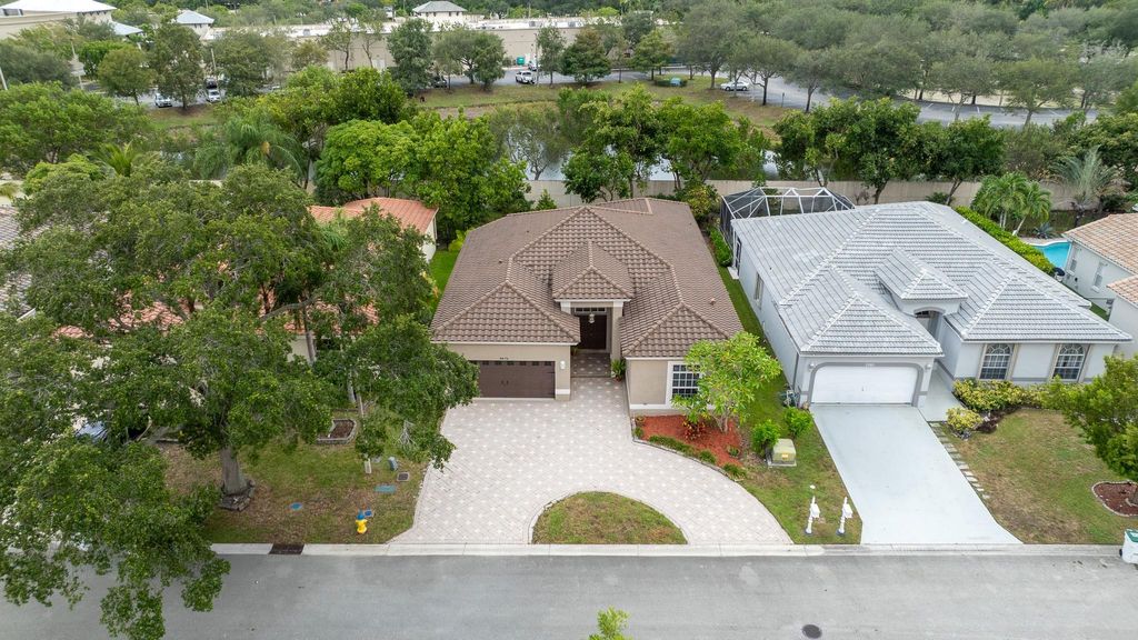 Photo of 5970 NW 72nd Ct, Parkland, FL 33067 (MLS # F10523710)