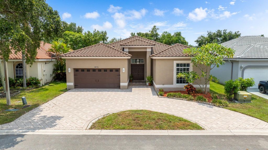 Photo of 5970 NW 72nd Ct, Parkland, FL 33067 (MLS # F10523710)