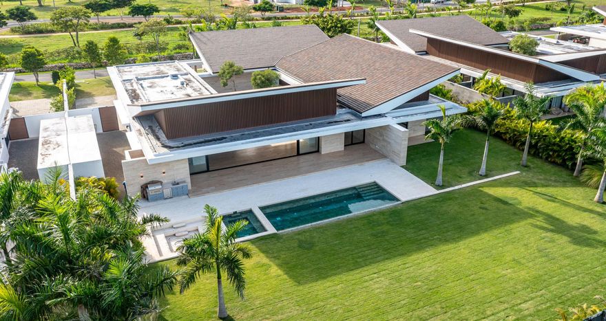This extraordinary Luxury Villa project stands among the most exclusive enclaves of Casa de Campo. Meticulously crafted to blend high-end comfort with natural splendor, the development showcases first‑class finishes designed by the esteemed Dominican architect Arturo Despradel. The project presents an encounter between modern design and local character in an exquisite way. Sloping ceilings, wide eaves, and generous spaces reference the Caribbean architecture of the region. The ample openings and pure, carefully chosen finishing materials create a distinct connotation and contrast with modern architecture.
