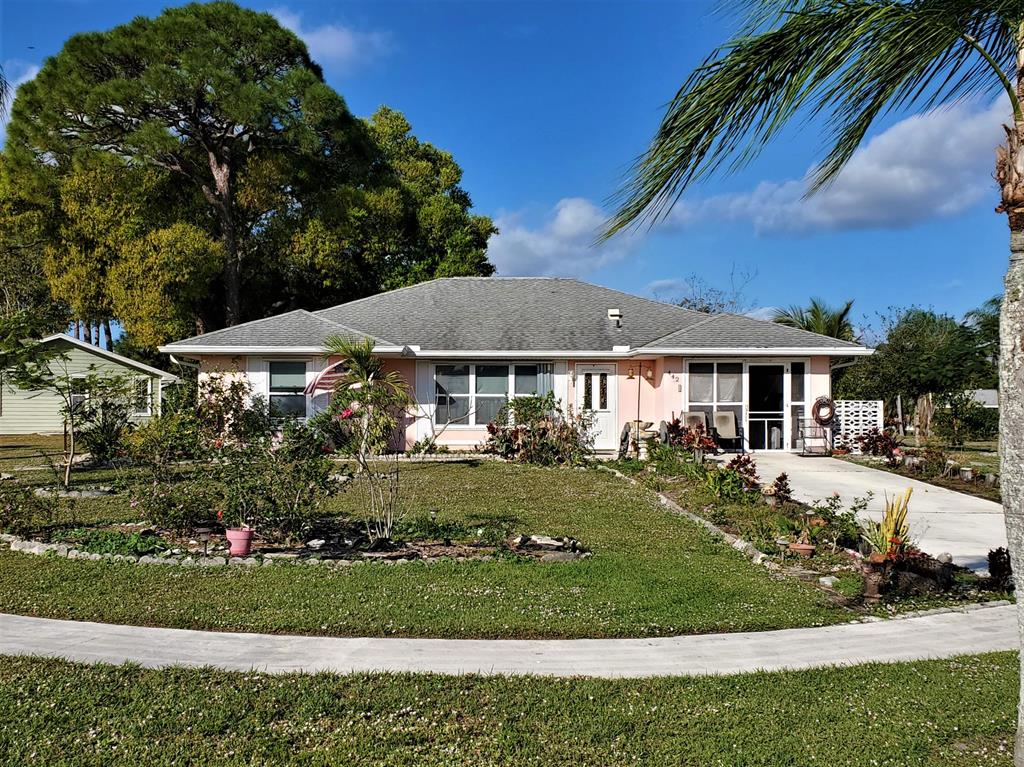 A Great Opportunity to Own this home which offers many possibilities, for a Buyer with a Vision to Make it Their Own. This Home has 1,877 SF Living Space (2,389 SF Total) on an Oversized Corner Lot 0.36 of an Acre and features 2 Bedrooms, 2 Full Baths, Large Living & Dining Area, Office Area, and a Huge Family Room 30' x 15' and has views of the Back Yard Area and No Homes directly adjacent rear of the home. Looking for Storage? This home has plenty to offer with a Bonus Storage Room or make it your Craft or Extra Room. Some other features include a Newer HVAC in 2018, Hurricane Shutters, a Separate Outdoor Lark Shed, and another Storage Unit attached to the home. You're just a short drive from Florida's pristine beaches, near I-95 & Turnpike, shopping & schools, and more! Plus No HOA!