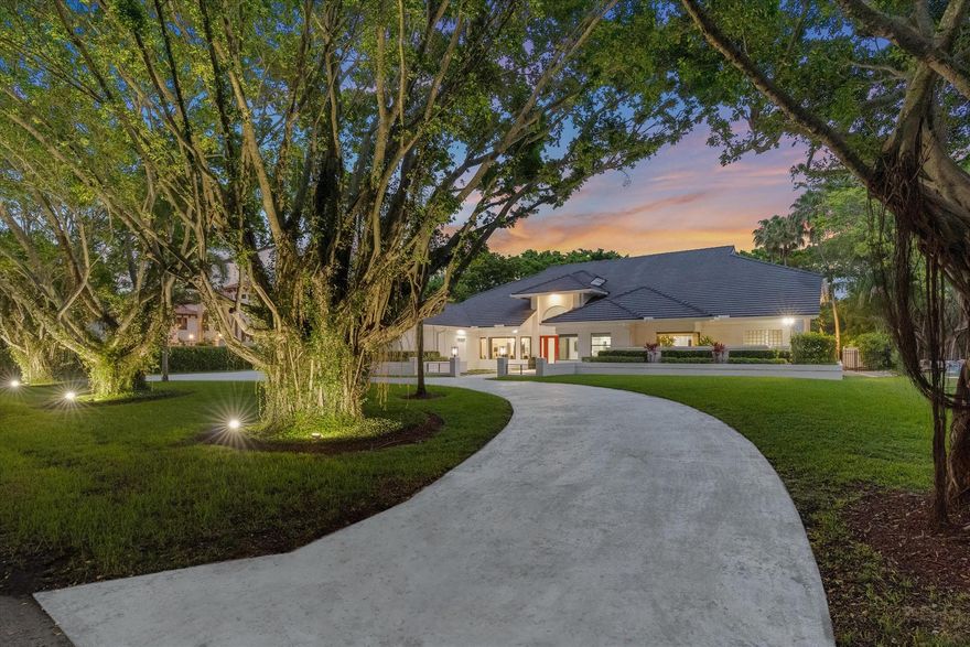 A very rare offering in the exclusive enclave of Long Lake Estates of Boca Raton this exceptional showcase  home rests on a private 48,000 SF lot.  Behind the manned security gates of this ultra private community in central Boca this 4BR/5BA family estate home offers something you don't find often these days, a lot size over an acre! The property is specially appointed with amenities such as a built in steam room in the primary bath, 24 foot ceilings in the main areas, and even a master closet with stairs that lead to a special enormous second floor room currently used as a theatre.  The expansive backyard has room to spare overlooking the private free form custom pool with hot tub, a lighted outdoor kitchen with grill, summer shower, and even a mini shed area for storage and pool