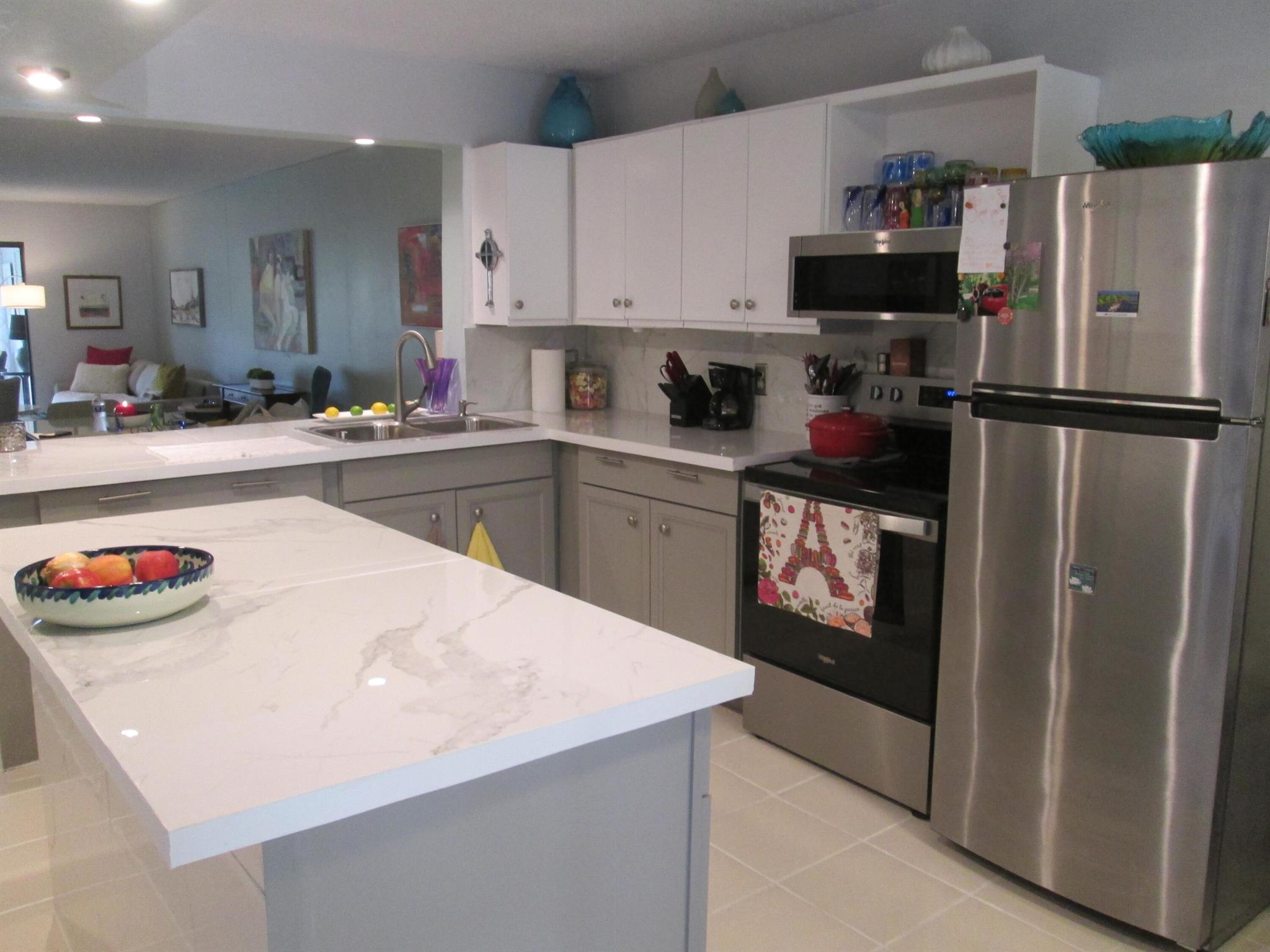 COME SEE THIS TURNKEY, 2 BEDROOM 2 BATHROOM VERY OPEN & SPACIOUS HOME WITH THE WALLS TAKEN DOWN TO OPEN THE WHOLE FLOOR PLAN & A BRAND NEW UPDATED KITCHEN WITH ALL STAINLESS-STEEL APPLIANCES & A HUGE ISLAND WITH MARBLE LIKE COUNTER TOPS. THE MASTER HAS A HUGE WALK IN CLOSET WITH A SEPARATE AREA FOR GETTING READY FOR A DAY OR NIGHT OUT IN THIS BEAUTIFUL SOUTH FLORIDA WEATHER. 2ND BEDROOM IS LIKE ANOTHER MASTER WITH THE BATHROOM UPDATED COUNTERTOP WITH A WALK IN SHOWER. ENJOY THE GORGEOUS VIEWS OF THE CANAL FROM YOUR ENCLOSED PATIO. WASHER DRYER IN THE UNIT.THIS GATED COMMUNITY HAS 2 HEATED POOLS W/JACUZZI'S, TENNIS COURTS, PICKLE BALL, A HUGE GYM, LIBRARY, ITS OWN THEATRE, TONS OF ACTIVTIES. LOTS OF GREAT DINING & SHOPPING IN THE AREA & POLO. CLOSE TO I-95 & THE TURNPIKE & PBA AIRPORT.
