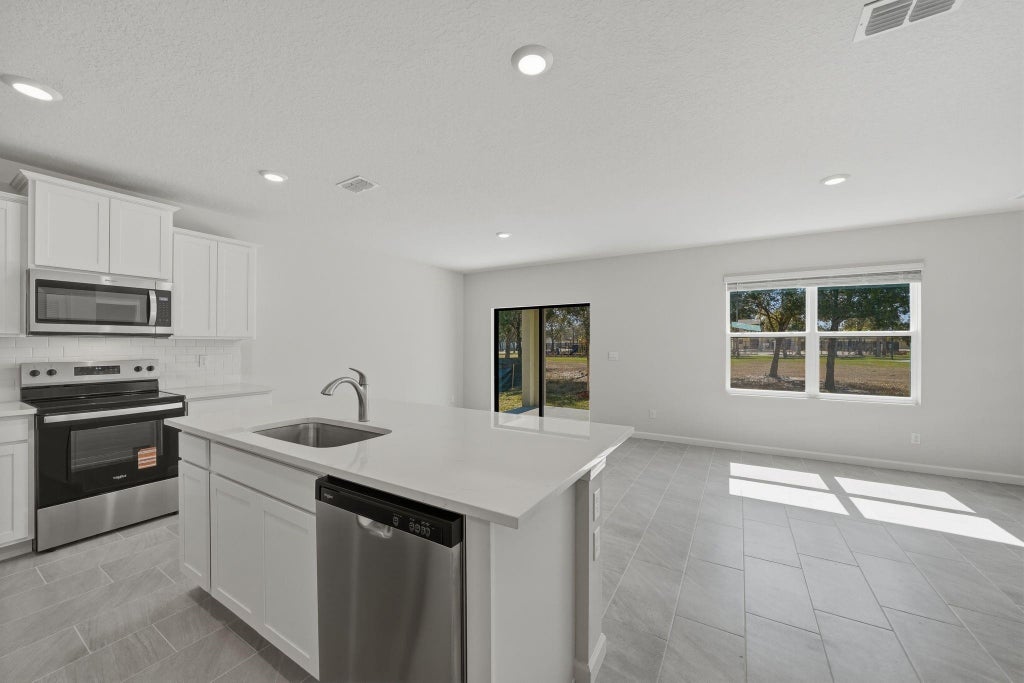 Photo of 9509 Silver Sands Lane, Fort Pierce, FL 34945 (MLS # B26075904)