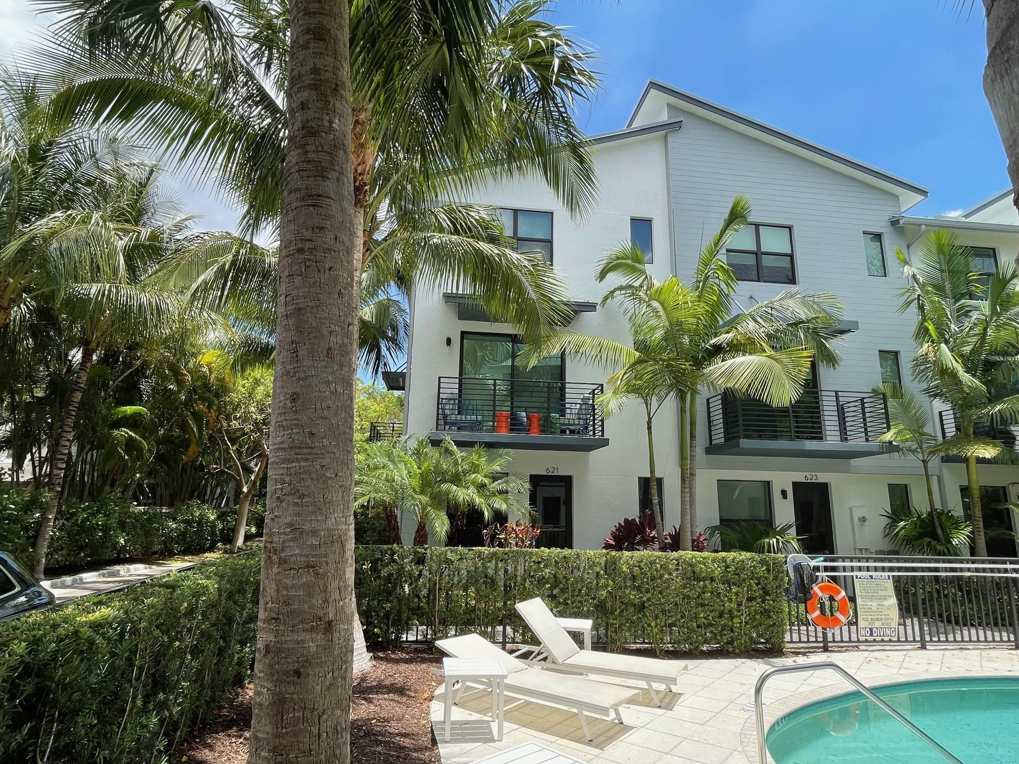 5-yr-old corner townhome w/2-car garage only one block from Wilton Drive and sound-protected by lush landscaping. The entire second floor provides wide open entertainment space, flowing from a windowed island kitchen and pantry, past a terrace and powder room, through the dining and living areas to a second terrace overlooking the heated pool. Upstairs, two spacious en suite bedrooms w/custom closets, separated by a laundry room. Enter through a large, corner “bonus room” + half bath for use as a guest room, den or office. This room is separate from the common space, offering private office space ideal for a professional who prefers to see clients at home. Tennis and pickle ball courts are across the street. Boutique, townhouse development with low HOAs. Prime investment opportunity.