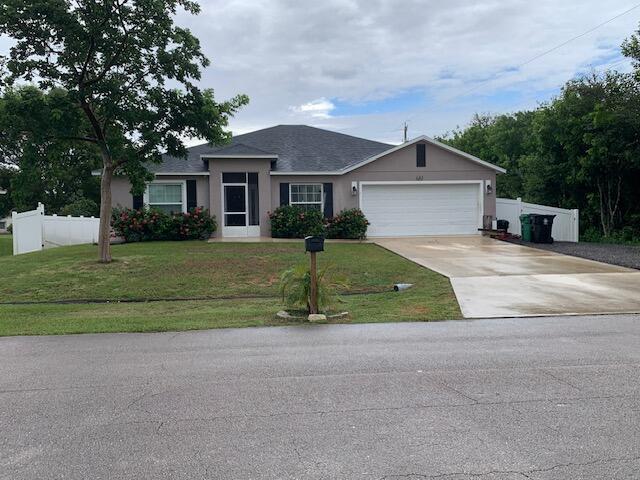 4/2/2 home built 2017 with impact glass windows, whole house water purifier, 20'' tile. Kitchen has granite countertops, tiled backsplash, stainless steel appliances and pass through to dining room. Vaulted ceilings, security system, PVC fenced in backyard and extended screened in, covered patio. *Room size measurements are approximate*