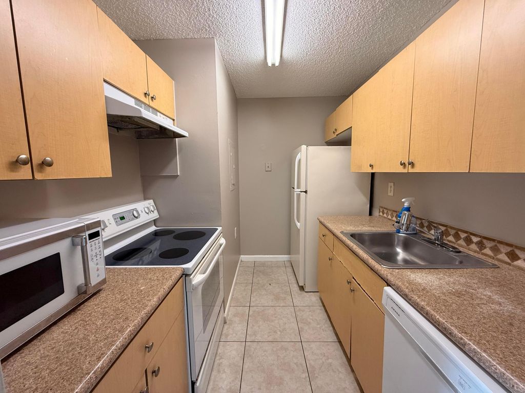 Photo of 1139 Lake Terry Drive #M, West Palm Beach, FL 33411 (MLS # B26020537)