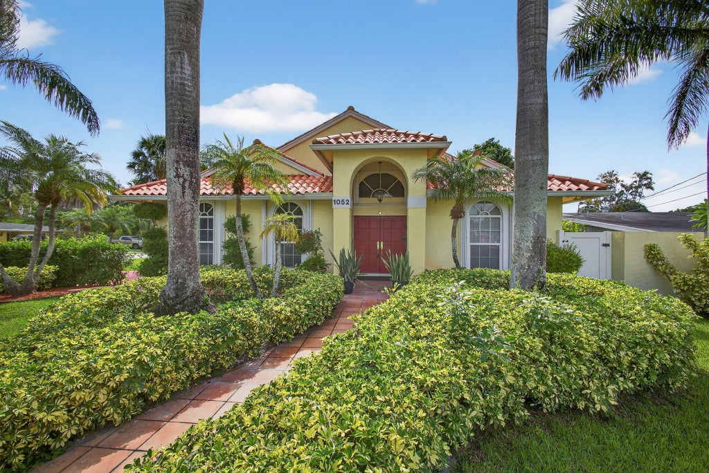 Photo of 1052 W SHORE Drive, West Palm Beach, FL 33406 (MLS # B26071360)