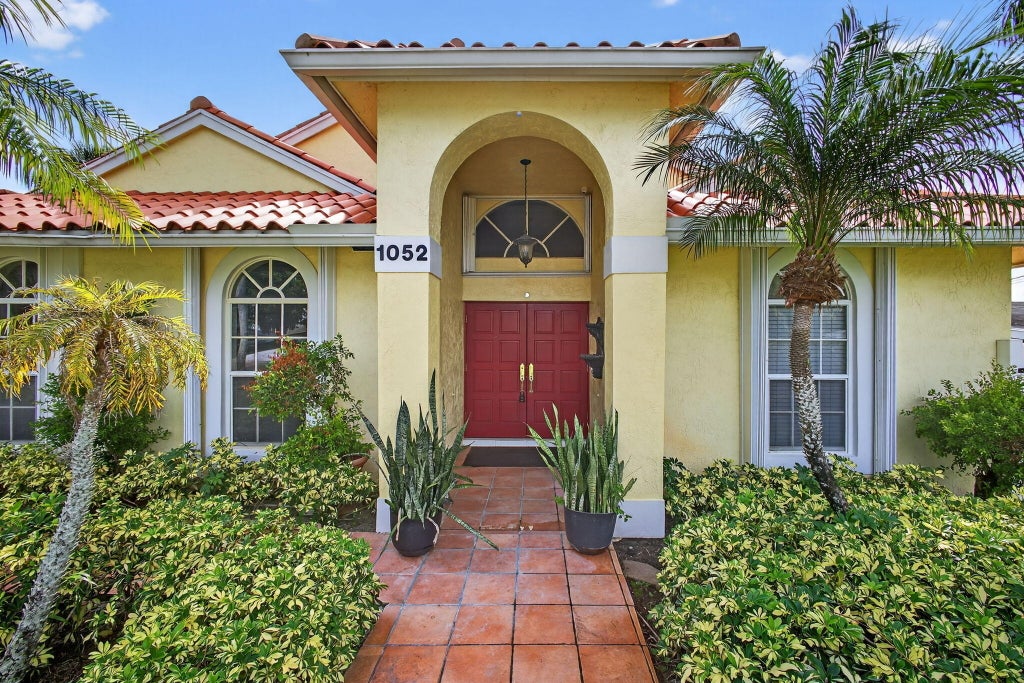 Photo of 1052 W SHORE Drive, West Palm Beach, FL 33406 (MLS # B26071360)