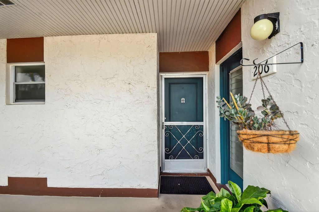 Photo of 4 N Greenway Vlg Village N #206, Royal Palm Beach, FL 33411 (MLS # B26000765)