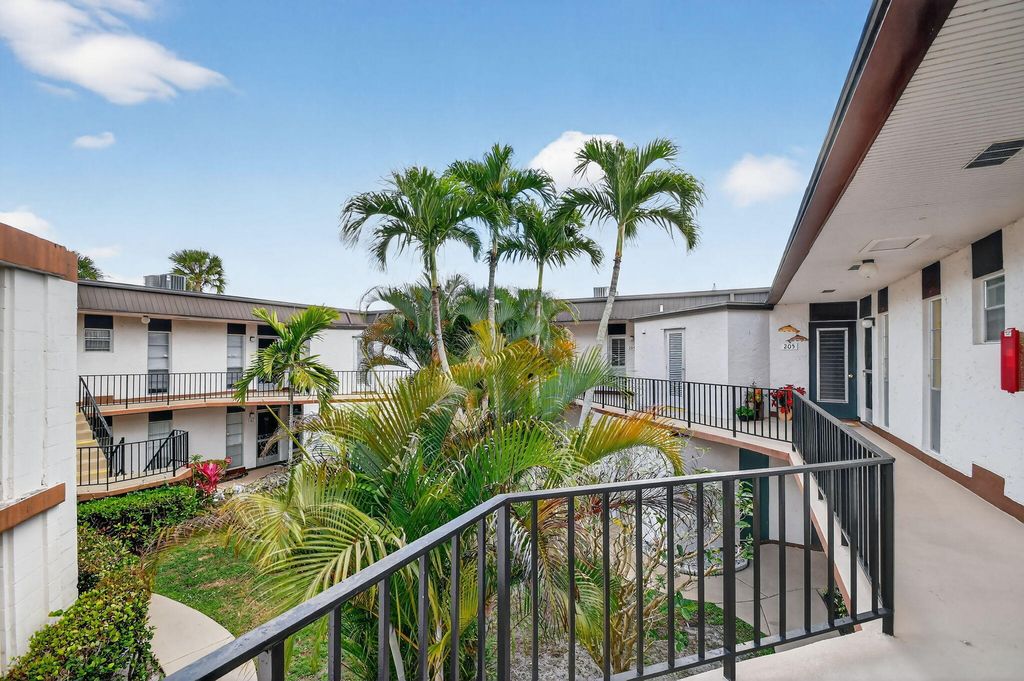 Photo of 4 N Greenway Vlg Village N #206, Royal Palm Beach, FL 33411 (MLS # B26000765)