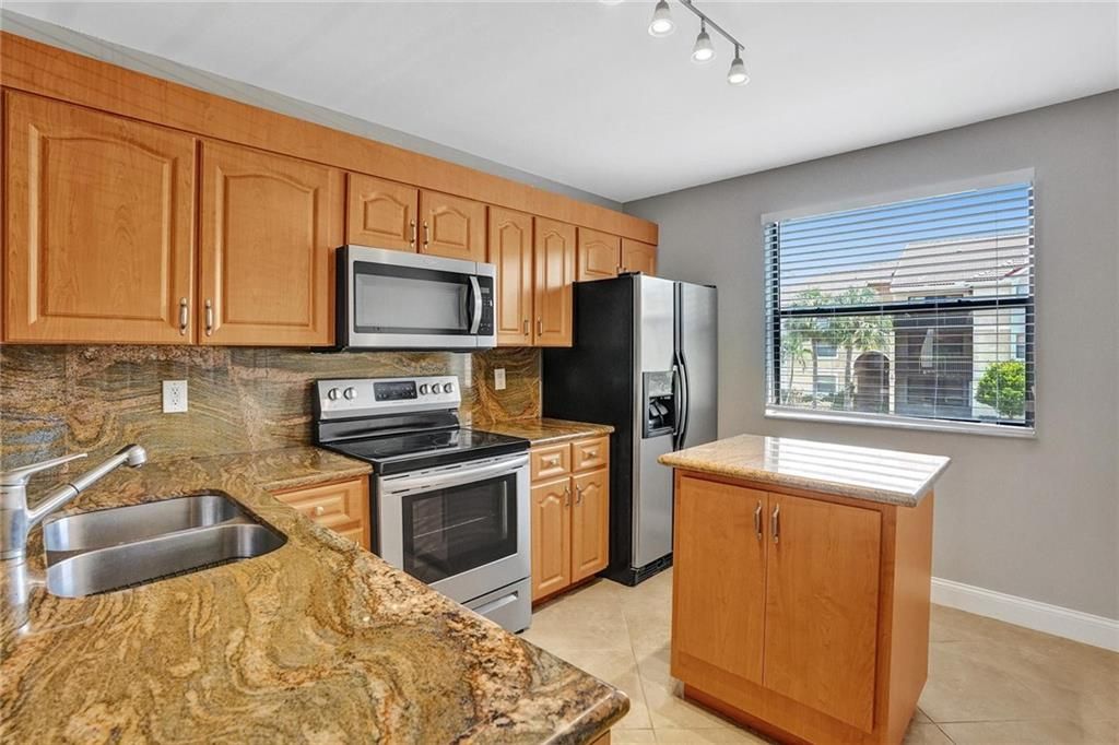 Photo of 5781 Riverside Dr Dr #201, Coral Springs, FL 33067 (MLS # F10347312)