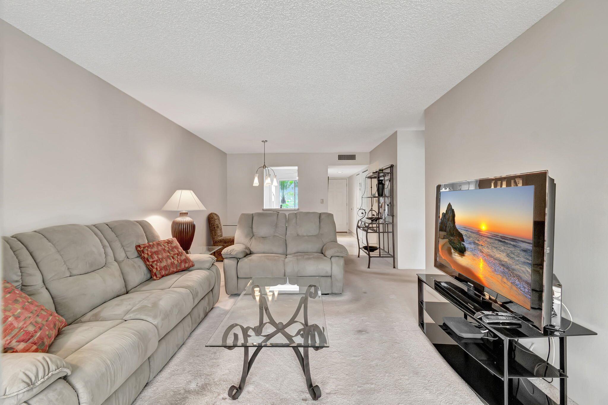 Huntington Lakes is a Super-Active Adult community---55+ Community!Immerse yourself in the tranquil living community of Huntington Lakes, Delray Beach, FL. This ground-floor unit, located at 6795 Huntington Lane, Unit 107, captures the essence of restful living with its harmonious blend of comfort and luxury.Upon entering the residence, you will be greeted by carpeted flooring that provides a soothing underfoot experience. A serene living space complements this, providing an ambiance of tranquility and calmness. The kitchen, complete with a pantry and an eat-in area, is accentuated by a large window that illuminates the interior with an abundance of natural light.