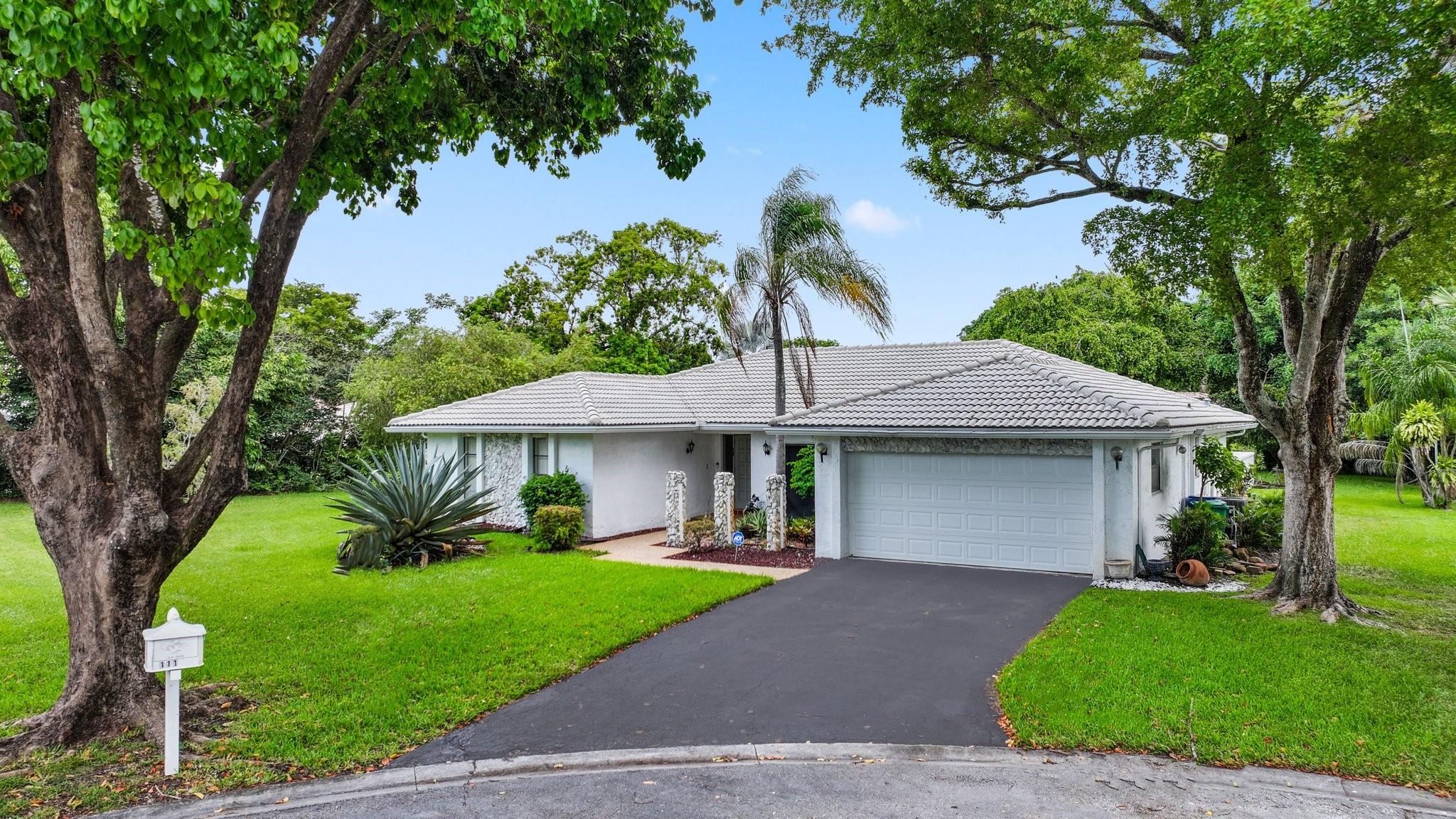 This is the first opportunity in 47 years to purchase this amazing cul de sac lot - the largest lot in the entire neighborhood. Featuring vaulted ceilings for a spacious feel, this home features large separate formal living, dining, and family rooms w/ eat-in kitchen area. XL covered and screened-in patio perfect for enjoying bug-free evenings & watching family play in the pool. So much room for kids or pets to roam in the backyard. Both bathrooms have been updated with newer tile & vanities. Master bedroom features 2 oversized walk-in closets w/ custom built-ins. 4th bedroom has been retrofitted into an exercise area w/ treadmill to make room for the 2nd walk-in closet in the master bedroom. Lots like this in Coral Springs for this price are extremely rare. Don't miss this one!