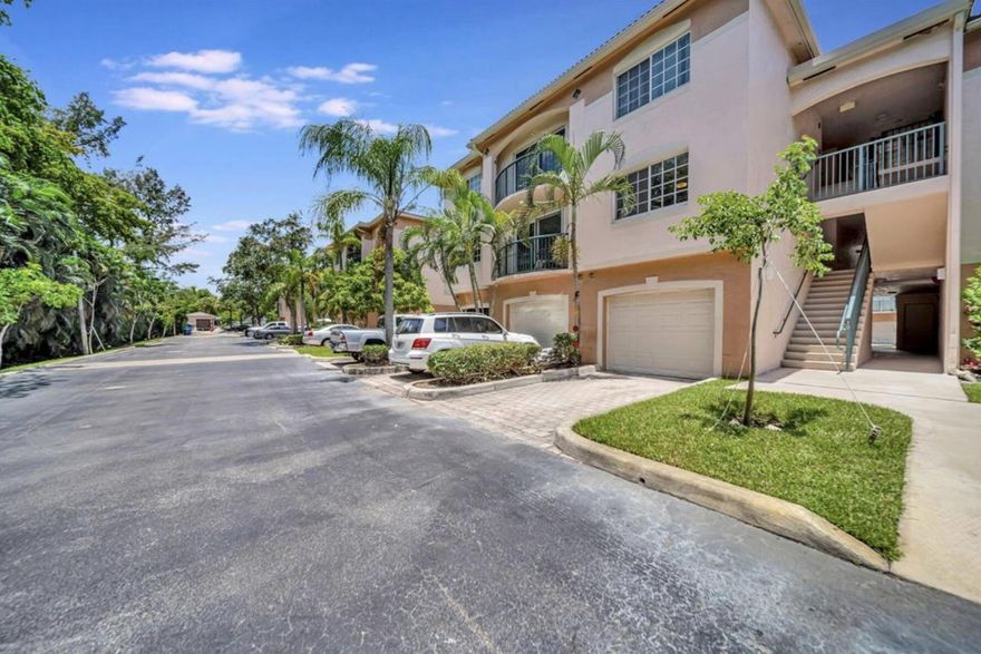Welcome to the gated, secured Village East. This unit is cleanly renovated *WITH GARAGE & WASHER DYER*. Located on the second floor with views of greenery, this residence features two expansive primary suites, each with its own walk-in closet. Just minutes from the beach and airport, and within walking distance to shops and restaurants, this condo offers the perfect blend of luxury, comfort, and accessibility, ensuring you have everything you need right at your doorstep. Pet friendly, guest parking, and great amenities including pool and fitness center.