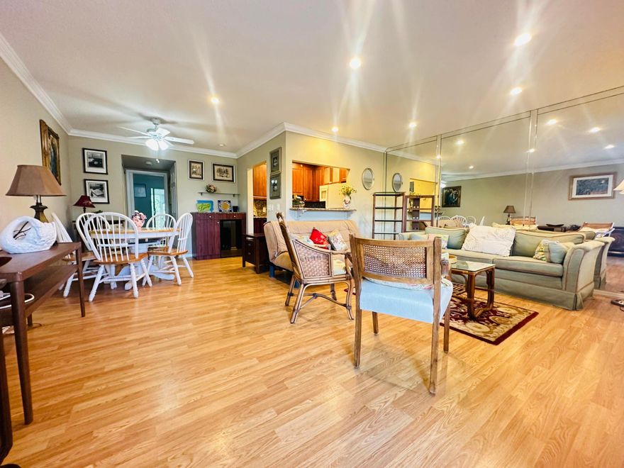 IMMACULATE renovated 1BR/1.5BA 2nd flr condo w/lift access, perfectly situated in a vibrant 55+ community.  Beautifully updated kit w/white appl, granite cntrs, dbl sink, recessed ltg, ext cabs for added strg w/a built in wine cooler. Bright, open liv space w/crown molding, Pergo flrs, recessed lts in liv rm & 2 window wall A/C's for great cooling.  Bathrms have been nicely updated incl a walk-in shower in primary. Relax on the screened patio w/roll down shutters and a serene garden view. Just steps to pool & tennis & close to West Gate! Enjoy an active, carefree lifestyle in a quiet, well-maintained setting! Century Village offers resort-style living w/a grand clubhouse, shows, classes, clubs, pools, tennis, pickleball, gym, clubs, classes, a courtesy shuttle & MORE!  Assoc. Claims 55+