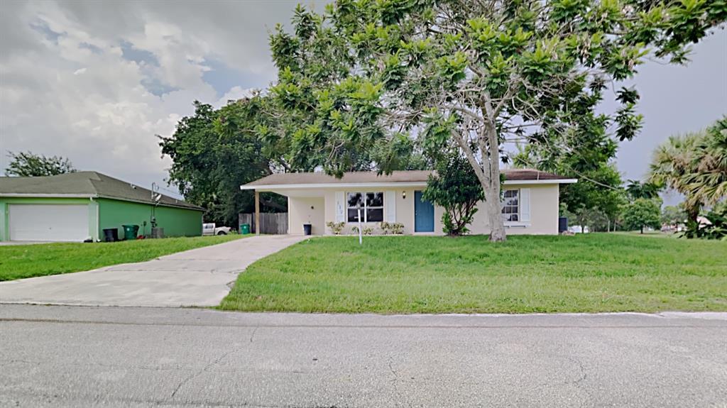 Photo of 117 SW Ray Avenue, Port Saint Lucie, FL 34953 (MLS # R10744724)