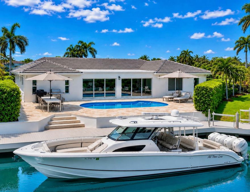 Stunning, completely reimagined, remodeled and repurposed waterfront residence in prestigious Venetian Isles, offering 60 feet of deepwater frontage with no fixed bridges and direct ocean access. This sophisticated 3BR/3BA split floor plan showcases an open-concept design with refined coastal finishes, a designer kitchen, and spa-inspired baths. Some of the many upgrades include a new roof, impact glass, new driveway and pool deck pavers, an expansive family room with water views and seamless indoor-outdoor living. Enjoy a private pool, new dock with electric, and serene water views. Perfect for boating enthusiasts and entertainment alike. Located in the highly sought-after city of Lighthouse Point, known for its safety, premier boating lifestyle, and exceptional coastal living.