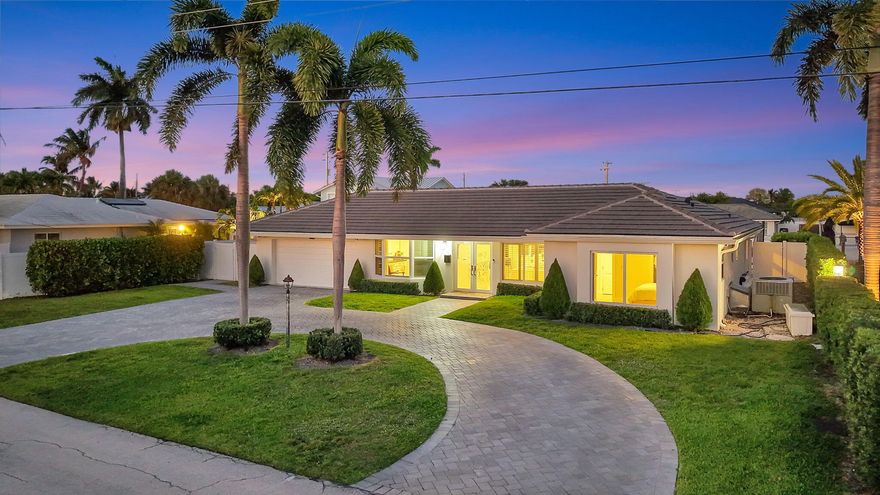 Stunning, completely reimagined, remodeled and repurposed waterfront residence in prestigious Venetian Isles, offering 60 feet of deepwater frontage with no fixed bridges and direct ocean access. This sophisticated 3BR/3BA split floor plan showcases an open-concept design with refined coastal finishes, a designer kitchen, and spa-inspired baths. Some of the many upgrades include a new roof, impact glass, new driveway and pool deck pavers, an expansive family room with water views and seamless indoor-outdoor living. Enjoy a private pool, new dock with electric, and serene water views. Perfect for boating enthusiasts and entertainment alike. Located in the highly sought-after city of Lighthouse Point, known for its safety, premier boating lifestyle, and exceptional coastal living.