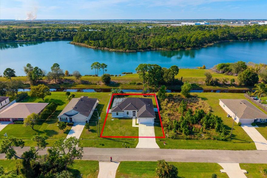 Welcome to this stunning 1st Story 2020-built home that offers a modern design, energy efficiency, and peace of mind. This home features full Hurricane-rated Impact Glass and doors! Enjoy tile flooring throughout, high ceilings, and a bright open layout. The split-bedroom design provides privacy, while the designer kitchen boasts granite counters and stainless steel appliances. The primary suite includes a spa-like bath with a soaker tub and separate shower. Backyard is Fully Fenced. Located in a desirable neighborhood, with No HOA & close to I-95. This home also includes solar panels, keeping electric bills around $25-$70 monthly. Owner would like to split the cost of the solar panels at closing. Call Today For an Appt!