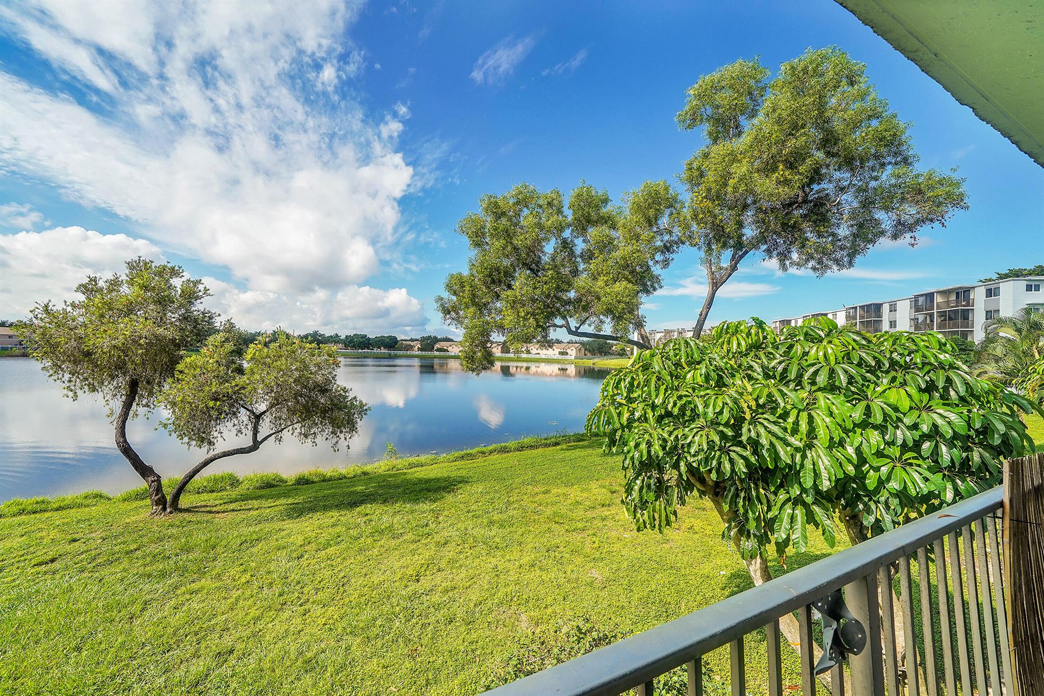Come see this perfect starter property today with a New AC and tile floors thurout. Bathrooms have been updated and comes with a nice porch with a view of the lake. Perfect location in the center of Miramar and low HOA dues. Come see what this beautiful home has to offer today!