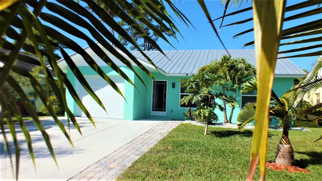 Photo of 5952 SE Collins Avenue, Stuart, FL 34997 (MLS # R10794217)