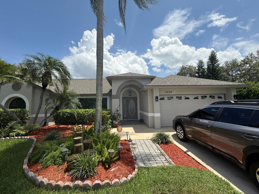 This beautiful home has been completely remolded with new engineered hard wood floors throughout living areas, new kitchen with quartz countertops, farmer stainless steel sink, lazy susan, garbage disposal, new roof, new ac, new high efficient storm windows, new remodeled bathrooms with jacuzzi in master bathroom, screened back patio, new water heater, high tops lightening, sky light, high vaulted ceilings, bedrooms are split floor plan, master bedroom has his and hers separate closets, knock down ceilings and walls, alarm system, high front sloped front yard, manicured and landscaped, attic has pulled down ladder in garage, laundry area has a sink, city water, close to schools, shopping, hospitals, parks, turnpike and I-95.