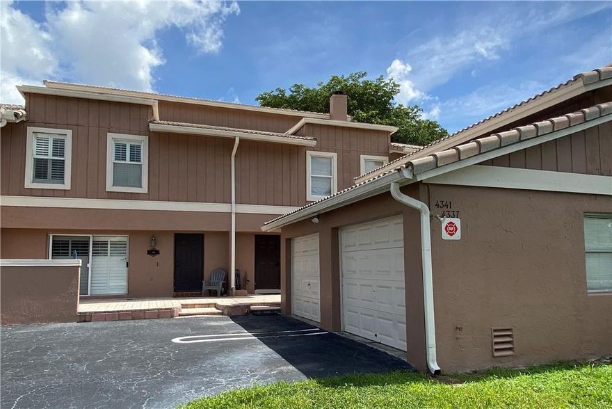 Open and spacious move in ready updated townhouse overlooking beautiful and tranquil canal and forest. Features include new waterproof laminate flooring, all white kitchen, wood burning fireplace, open floor plan, large rooms, lots of closets, updated bathrooms, whirlpool tub, 1 car garage, front courtyard, hurricane impact windows, and beautiful patio overlooking peaceful and tranquil setting,