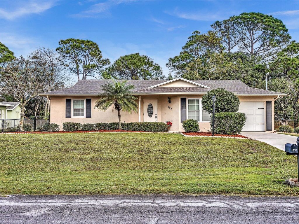 Photo of 227 SE Grove Avenue, Port Saint Lucie, FL 34983 (MLS # R10949046)