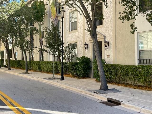 Come live and be walking distance to the highly desirable and newly renovated ''The Square of Downtown West Palm''. First floor condo featuring many upgrades. Hardwood floors throughout. Granite countertops with white wood cabinets. New washer and dryer, water heater and A/C. Large roman tub in bathroom, large walk in closet. Water included with rent. 1 Pet allowed with restrictions. $350.00 non-refundable pet fee. Rare secured and deeded space in parking garage. Newer stainless steel appliances
