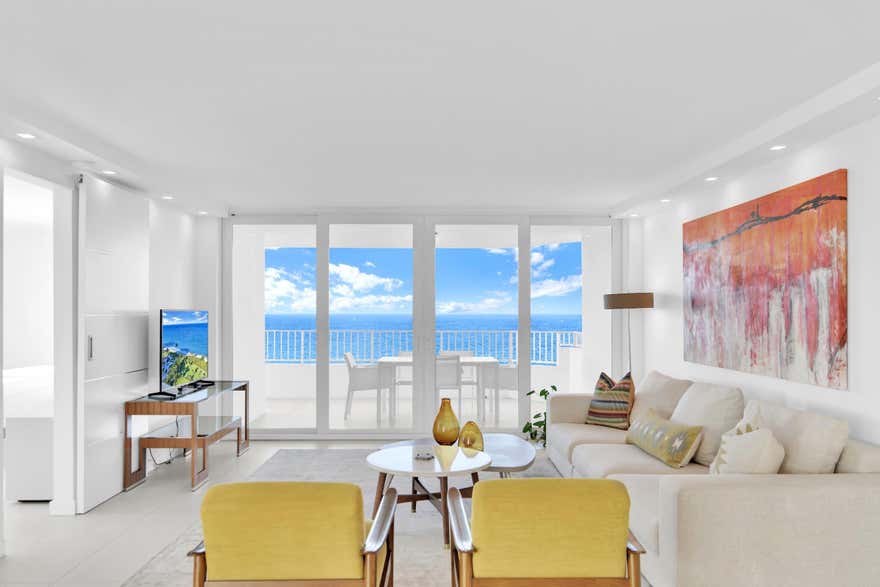 Rarely available wraparound corner residence beautifully renovated with sophisticated, modern finishes and impeccable attention to detail. This stunning mid-floor unit showcases sweeping panoramic views of the Atlantic Ocean, Lake Boca, the city skyline, and lush tropical gardens from every room. Expansive windows fill the residence with natural light, creating an exceptional indoor-outdoor coastal living experience. Located at the prestigious The Chalfonte, residents enjoy a fully renovated oceanfront property with world-class resort-style amenities. The building features a state-of-the-art fitness center, two beachfront swimming pools, private marina, business center, two tennis courts, waterfront BBQ areas, putting greens, elegant party rooms, and breathtaking Japanese gardens througout