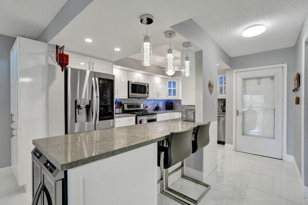 Photo of 5860 NW 44th Street #314, Lauderhill, FL 33319 (MLS # B26029261)