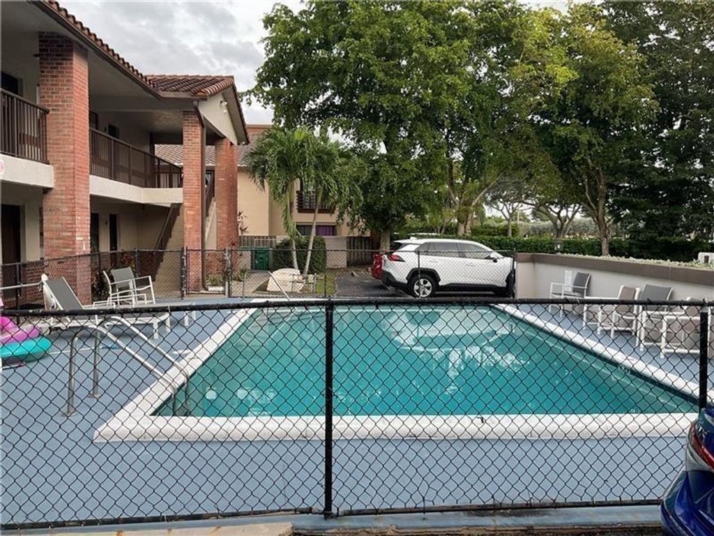 Photo of 10825 Royal Palm Boulevard #1-8, Coral Springs, FL 33065 (MLS # B26006863)