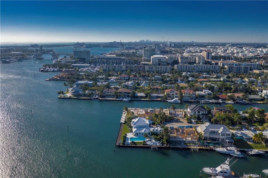 Lauderdale Harbors point lot estate with stunning Intracoastal views and 255' of water frontage! A boater's dream, this home can easily accommodate a mega yacht and still afford wide water views. Constant breeze and welcoming outdoor spaces with over-sized pool to enjoy the South Florida lifestyle. Features include security system, high ceilings, full air-conditioned attic, formal dining room and family room. Private master bedroom has whole second level to itself and master bath with dual vanities. Renovate or build your dream home here!