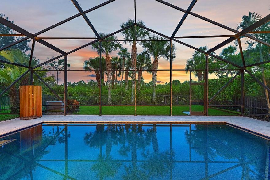 Welcome to 236 Carina Drive, an elegant single-story residence in Jupiter Country Club WITH IMMEDIATE GOLF MEMBERSHIP. This beautifully appointed home features 3 bedrooms, 2.5 baths, and a versatile den across 2,621 square feet of living space and air conditioned 3-car garage. The open-concept showcases soaring coffered ceilings, hardwood and marble flooring throughout and a chef's kitchen with Wolf appliances and custom cabinetry. The primary suite offers Full Sauna, dual walk-in closets and preserve views. Outside is a private oasis with a heated salt system pool, cold plunge and fully equipped summer kitchen—perfect for year-round entertaining. Additional highlights include a whole-house generator, water purification system, and impact glass throughout.