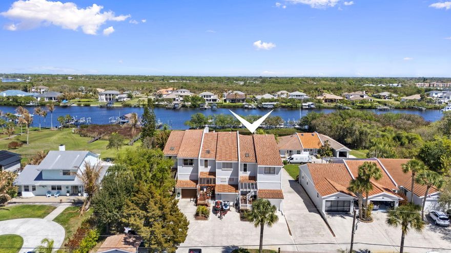 Welcome to 2985 SE South Lookout Blvd in Norseman's Harbor, a desirable waterfront community in Port St. Lucie. This 3-bedroom, 2.5-bath townhome offers 1,622 living sq ft plus a versatile flex room that can serve as a fourth bedroom, office, or den. The home features a bright multi-level layout and a one-car garage with a built-out fisherman's prep area for cleaning and preparing your catch. Enjoy subtle river peeks and access to your private dock with ocean access, with all dock fees included in the low HOA. Residents also enjoy a community pool. A 2020 roof adds peace of mind, and an assumable mortgage opportunity may offer favorable financing. Conveniently located near shopping, dining, and major roadways.