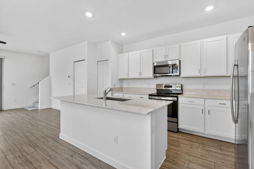 GORGEOUS CORNER UNIT W/ OPEN FLOOR PLAN & PLENTY OF WINDOWS WHICH BRING IN AN ABUNDANCE OF NATURAL LIGHT. ISLAND KITCHEN W/ STAINLESS STEEL APPLIANCES & WHITE CABINETRY OPENS UP TO SPACIOUS DINING/FAMILY ROOM, WOOD DESIGN TILE IN LIVING AREAS AND DESIGNER FANS W/ LIGHT IN ALL ROOMS. LOUVERED BLINDS ON ALL WINDOWS. DEN ON 1ST FLOOR CAN BE 4TH BEDROOM/OFFICE. SLIDING DOORS OPEN TO YARD FOR OUTDOOR RELAXATION. ALL BEDROOMS ARE UPSTAIRS FOR PRIVACY. PRIMARY BEDROOM HAS OVERSIZED WALK-IN CLOSET. 2ND & 3RD BEDROOM CONNECT TO JACK & JILL BATHROOM W/ TUB -SHOWER COMBO. W/D UPSTAIRS FOR EASE OF USE. IMPACT WINDOWS THROUGHOUT AND EPXOY COATING ON GARAGE FLOOR. GREAT COMMUNITY CLOSE TO ALL THINGS BEAUTIFUL IN PORT ST. LUCIE