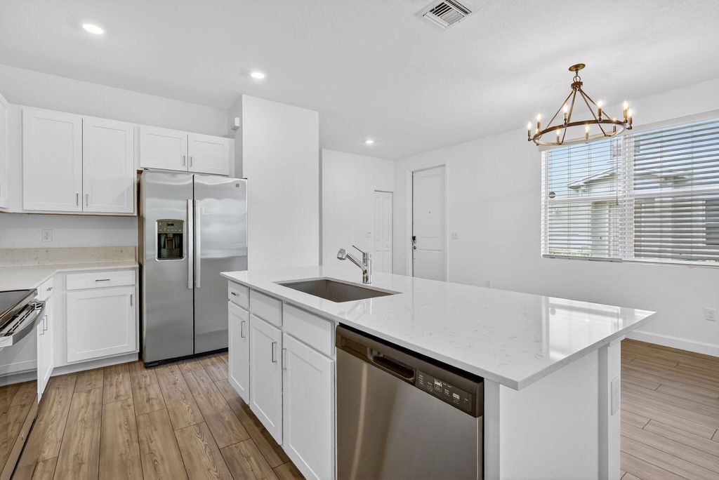 Photo of 211 SE Woodbark Street, Port Saint Lucie, FL 34984 (MLS # B26009600)