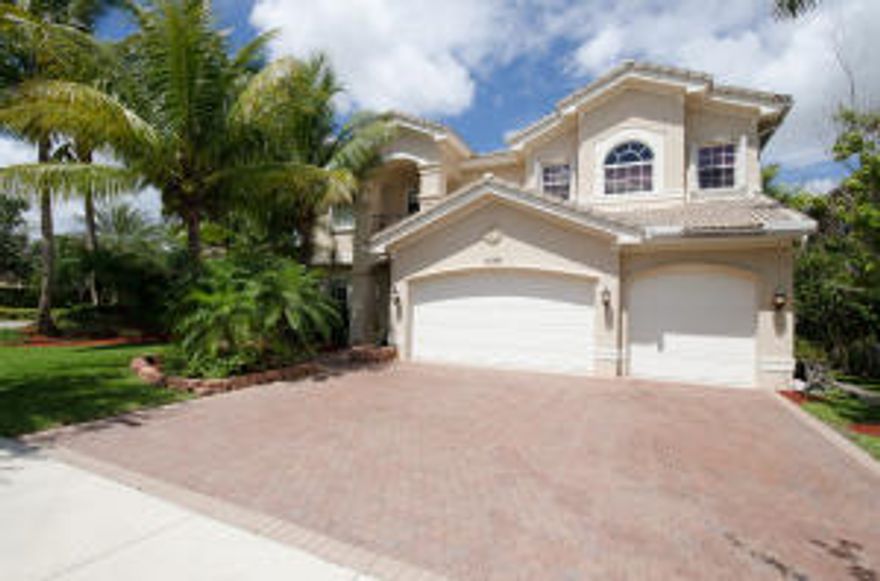 This incredible Pool Home on Water in Canyon Isles with over 4000 living square feet & no neighbors on one side is gorgeous. The entire home has accordion shutters all around. Inside you will notice the tile laid on the diagonal throughout the living areas. There is crown molding throughout & the living room has custom moldings as well. The stunning kitchen features 42'' wood cabinets with crown molding & undercabinet lighting. The cabinets also include pot & pan drawers, a lazy susan & a pantry facade. In addition, there are granite counters with full tile backsplash & a GE Profile S.S. double oven & microwave. The large family room is wired for surround sound. The incredible pool & spa overlook stunning lake views. There is an extended paver patio with massive covered area with awnings.