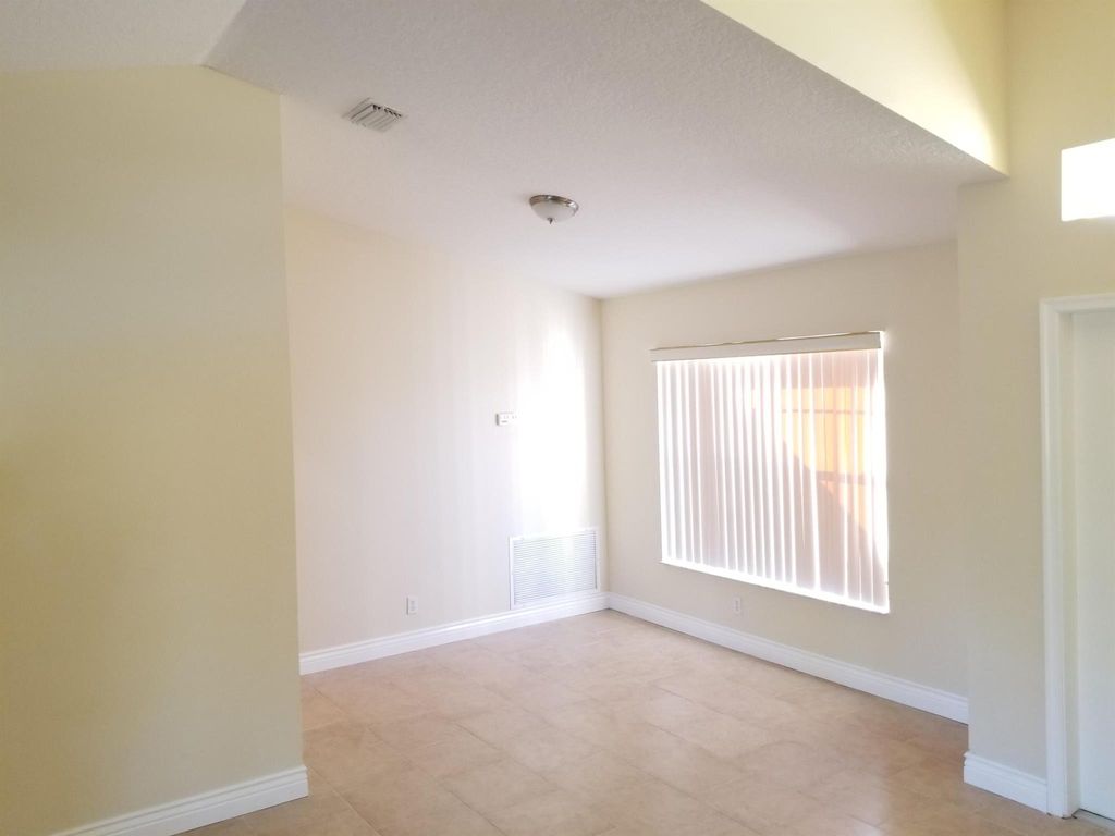 Photo of 425 SW Mccomb Avenue, Port Saint Lucie, FL 34953 (MLS # R11005154)