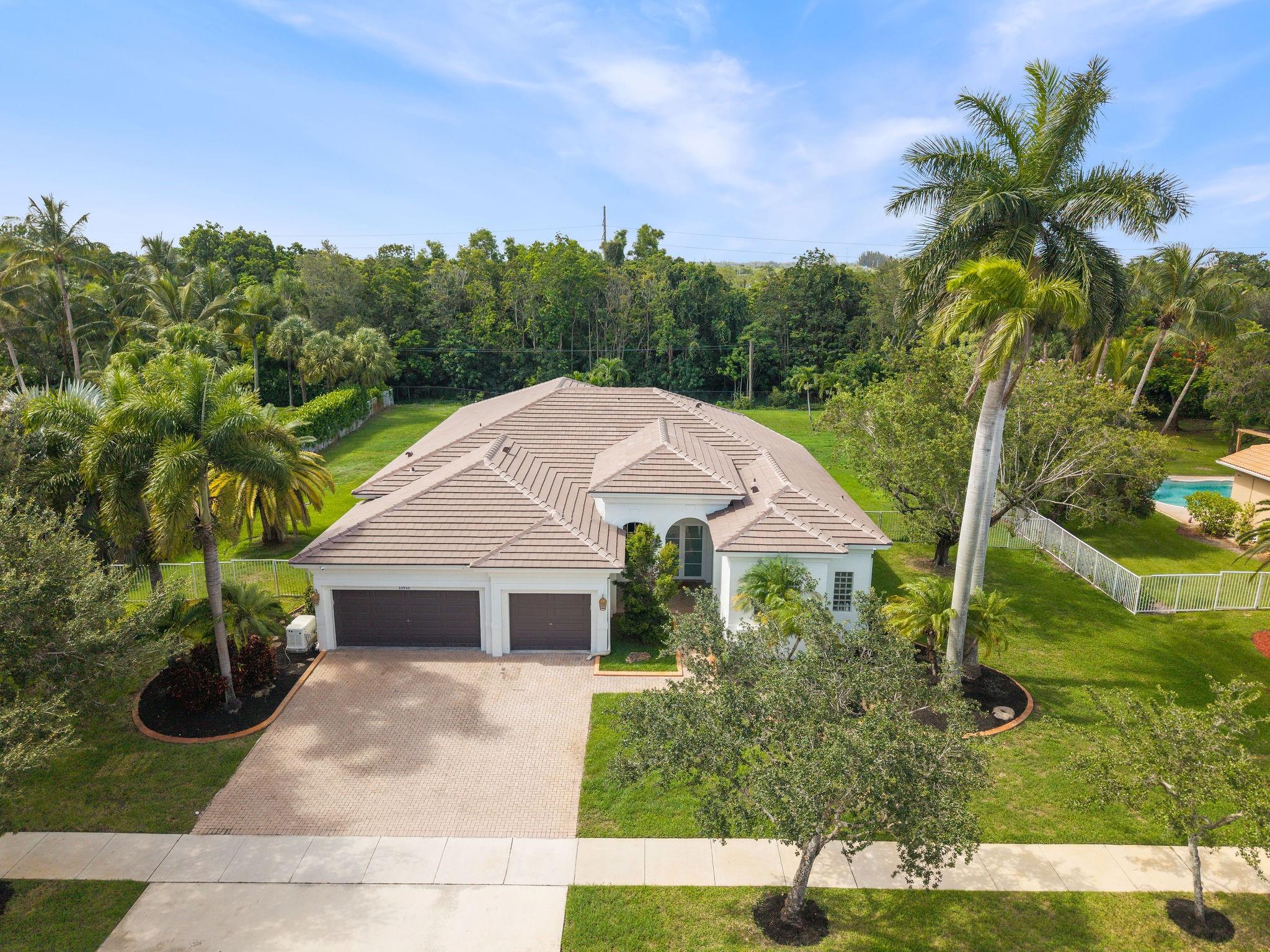 ***HIGHLAND RANCH ESTATES!!!*** NESTLED ON OVER A 1/2 ACRE, THIS 5 BEDROOM W/3 FULL BATHROOMS AND 3 CAR GARRAGE OFFERS A TRIPLE SPLIT FLOOR PLAN...IDEAL LAY OUT FOR PRIVACY! 12 FOOT CEILINGS IN ALL THE SOCIAL AREAS! BRAND NEW ROOF! IMPACT GLASS AND DOORS! FULL HOUSE GENERATOR! 2 A/C'S INSTALLED IN 2017. BEAUTIFUL PRIVATE FENCED YARD WITH FRUIT TREES. PLENTY OF YARD SPACE FOR A POOL AND GREEN AREA FOR THE KIDS AND DOGS TO PLAY!