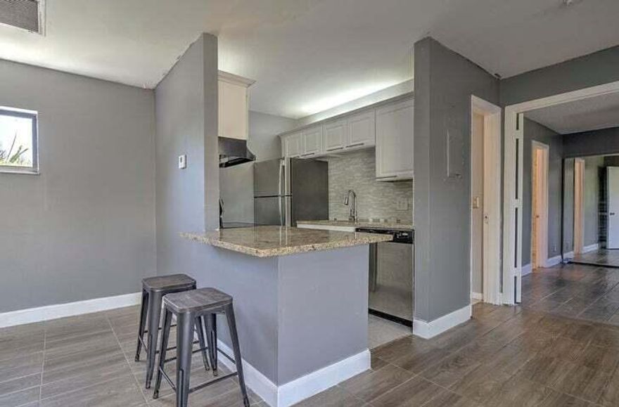 Very clean & Move-In-Ready 2-Bedroom Home - Freshly Updated Inside & Out!Recently painted throughout and featuring a brand-new roof on the building, this home offers peace of mind the moment you step inside. The bright, open-concept layout flows effortlessly with all-new flooring (no carpet anywhere!), creating a clean, modern feel that's easy to maintain--perfect for families, pets, or anyone who values a spotless home. Highlights you'll love: 2 private decks for relaxing or outdoor dining, Central A/C and washer & dryer, dishwasher. Fresh interior paint and a brand-new building roof. Sparkling community pool, lighted tennis courts, and scenic walking paths