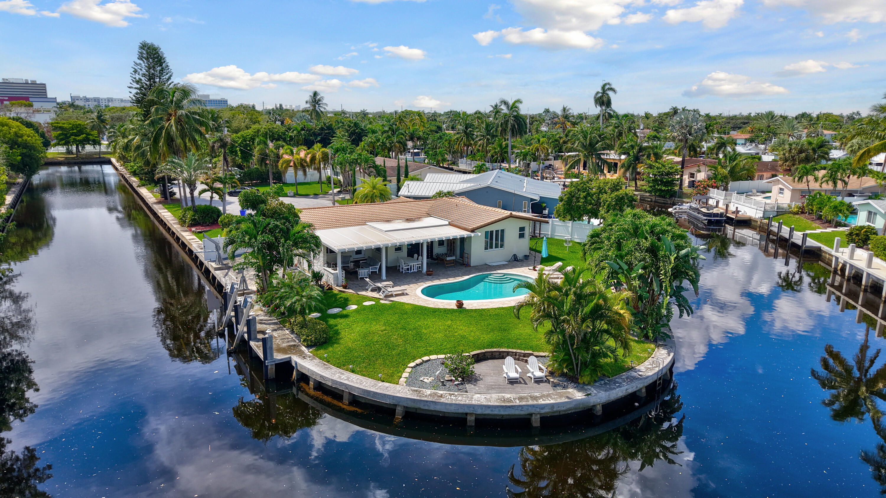 Luxury waterfront rental on a rare cul-de-sac point lot! This residence offers 289' of commercial-grade seawall, hurricane-impact windows/doors, and stunning tropical views. The updated custom kitchen anchors the home, while dual master suites provide private retreats. Outdoor living is effortless with a sunlit pool, covered patio, and dedicated space for kayaks or paddleboards. Two boat lifts and easy Intracoastal access (only one fixed bridge) make this a boater's paradise. A true blend of elegance, comfort, and security in a premier South Florida setting. Available for seasonal or annual lease - schedule your private showing today!