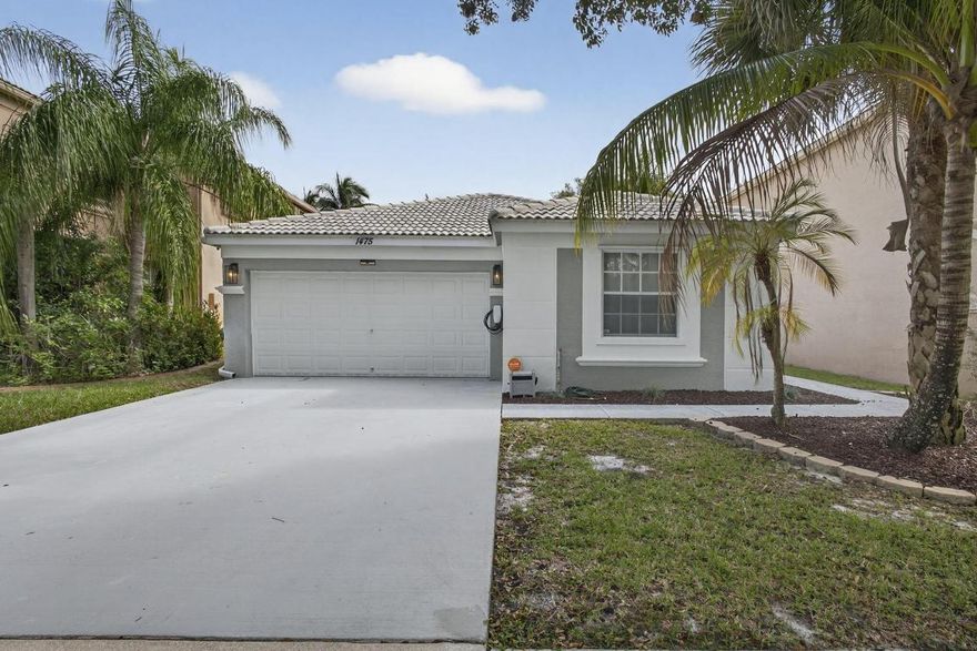 Welcome to this beautifully maintained single-story home in the desirable Madison Green community of Royal Palm Beach. Offering 4 spacious bedrooms, this residence delivers comfortable, easy living with a functional one-level layout ideal for families and downsizers alike. Recent upgrades include a new refrigerator (2025) and a newer A/C system (2021), providing peace of mind and energy efficiency. The open living areas flow seamlessly, creating an inviting space for both everyday living and entertaining. Located in the sought-after Madison Green golf course community (no membership required) residents enjoy access to amenities such as a clubhouse, pool, tennis courts, and scenic walking paths—all just minutes from shopping, dining, and top-rated schools.