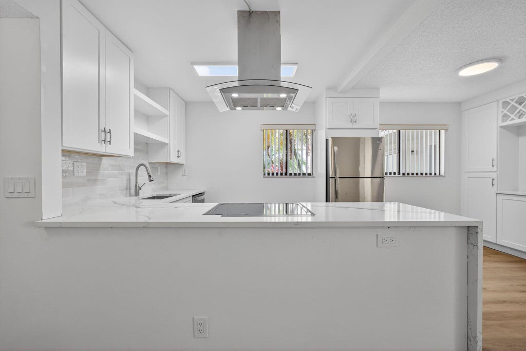 Photo of 15036 Ashland Lane #44, Delray Beach, FL 33484 (MLS # R11103815)