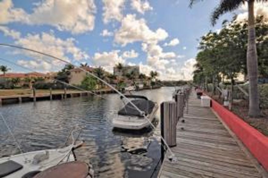 Come bring your boat!  Docks are amazingly only $1.25 per lin ft. Spectacular manned gated intracoastal community.  Renovated to perfection your incredibly spacious condo.  Wood floors throughout.  New baths with granite.  Kitchen wall opened up for entertaining.  Modern kitchen with stainless steel appliances and granite.  Tons of closet space.  Storage unit in building.