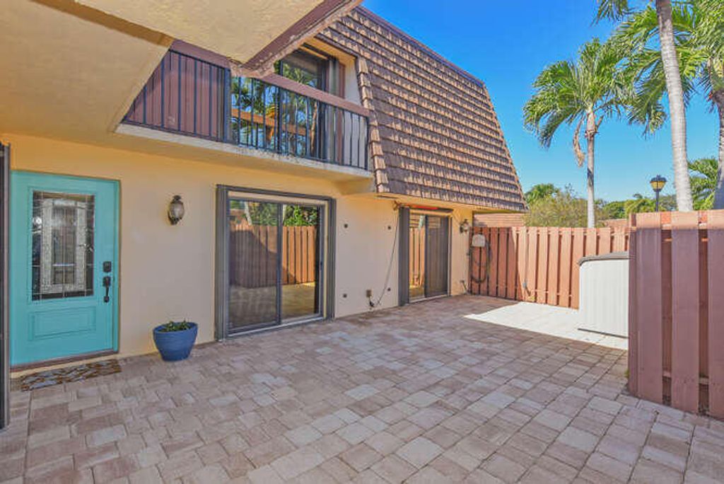 Photo of 11 Atrium Circle #D, Atlantis, FL 33462 (MLS # R11136678)